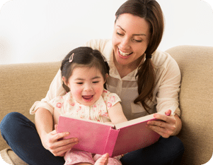 A Seattle area nanny reading a book to a young child