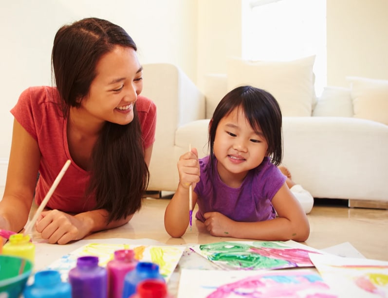 A temporarily placed nanny engaging with a child at the clients home.