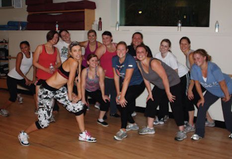 Pair You With A Family A group of nannies from A Nanny For U participating in a group workout.
