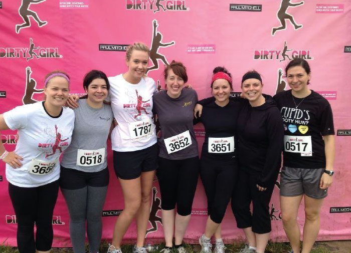 Nannies from A Nanny For U showing their team spirit at a physical outdoor event.